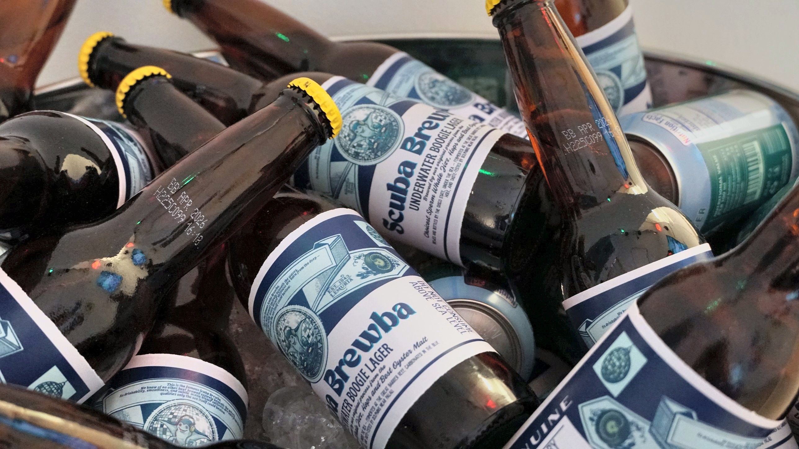 Scuba Brewba bottles and cans in an ice bucket at The Disco State